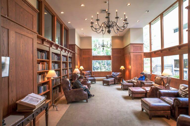 ODY Library Reading Room with students sitting in chairs reading