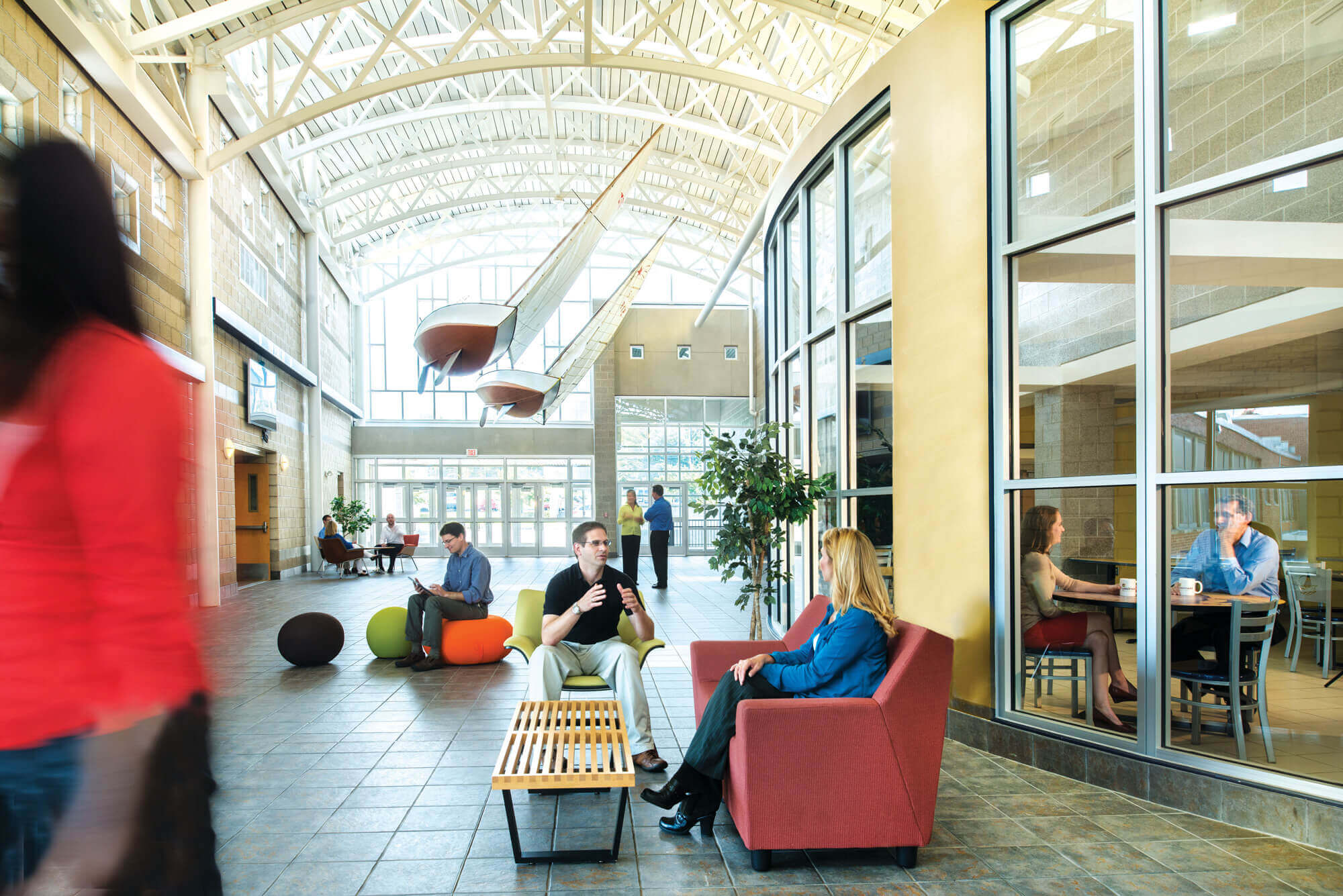 people working and talking inside atrium