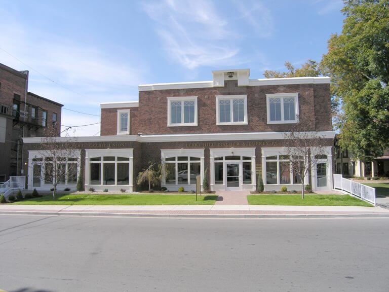 brick building with large ground floor windows
