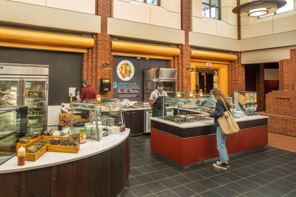 Student makes meal selection at the new gluten free serving station